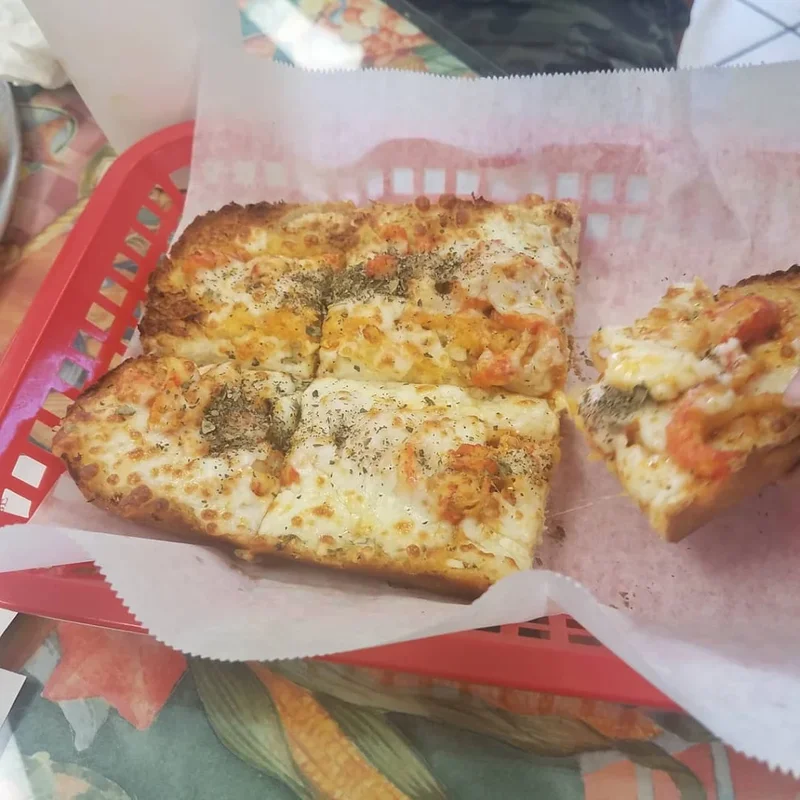 NOLA Crawfish Bread - A New Orleans classic – cheesy, spicy crawfish baked onto French bread.
