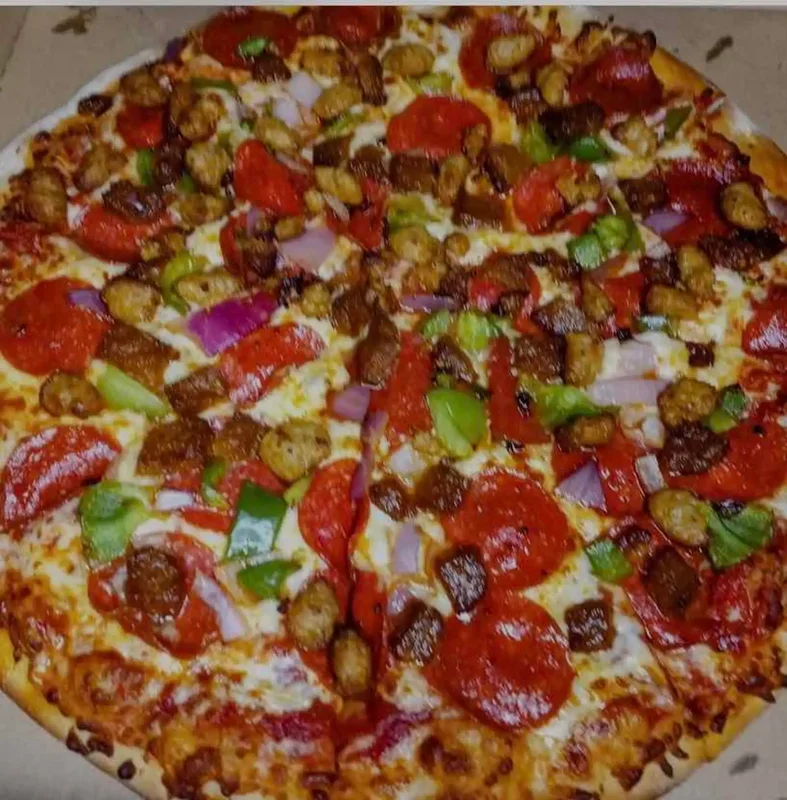 Spicy Hot Sausage Pizza - For those who like a kick, our hot sausage pizza delivers bold flavor and satisfying spice.
